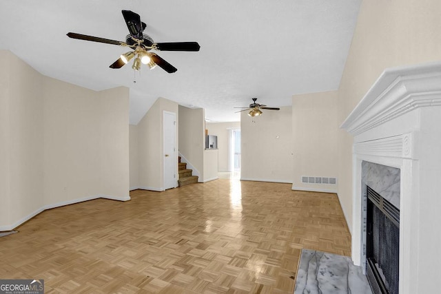 6359 Wedgeview Dr, Tucker, GA 30084 - unfurnished living room featuring ceiling fan, baseboards, stairway, and a fireplace