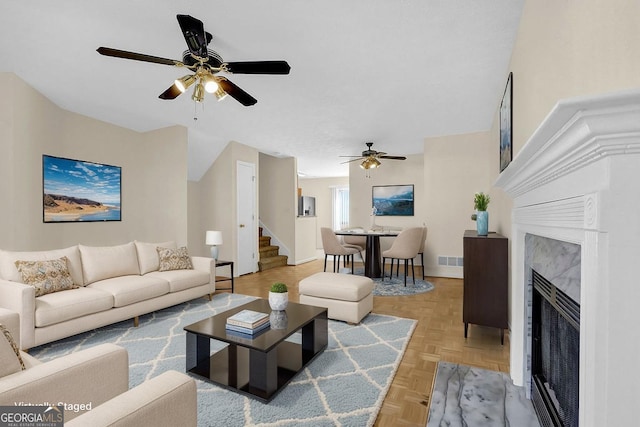 6359 Wedgeview Dr, Tucker, GA 30084 - living room with ceiling fan, stairs, baseboards, and a high end fireplace
