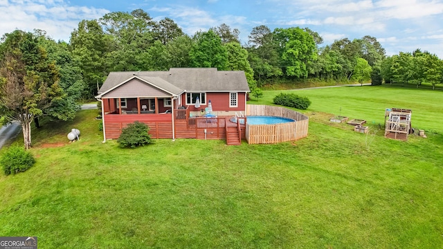 739 Rockford Creek Rd, Clarkesville, GA 30523 - back of house featuring an outdoor pool, a yard, a sunroom, and a deck