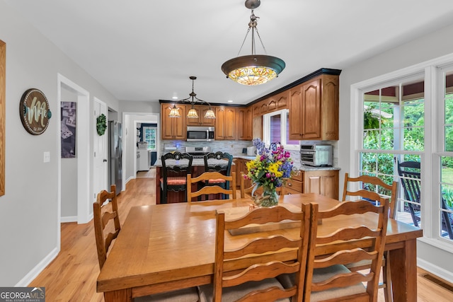 739 Rockford Creek Rd, Clarkesville, GA 30523 - dining room featuring baseboards and light wood-type flooring