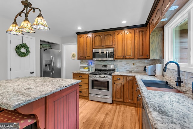 739 Rockford Creek Rd, Clarkesville, GA 30523 - kitchen with appliances with stainless steel finishes, a sink, light stone counters, tasteful backsplash, and recessed lighting