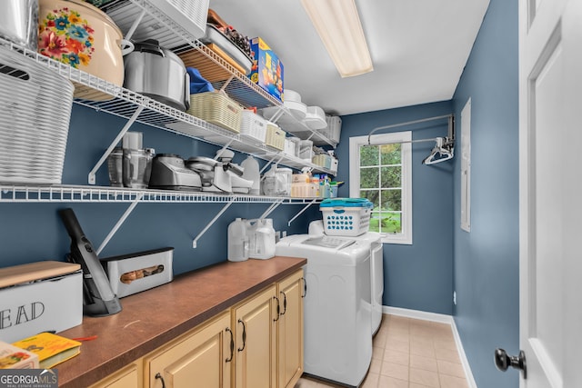739 Rockford Creek Rd, Clarkesville, GA 30523 - laundry room featuring washer and clothes dryer, cabinet space, light tile patterned flooring, and baseboards