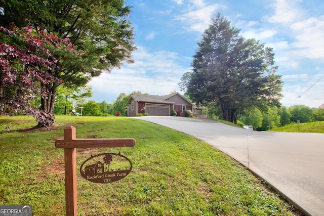 739 Rockford Creek Rd, Clarkesville, GA 30523 - view of front of property with concrete driveway, a front yard, and a garage