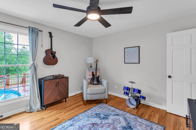 739 Rockford Creek Rd, Clarkesville, GA 30523 - sitting room with wood finished floors, ceiling fan, and baseboards