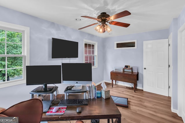 739 Rockford Creek Rd, Clarkesville, GA 30523 - home office featuring a ceiling fan, wood finished floors, and baseboards