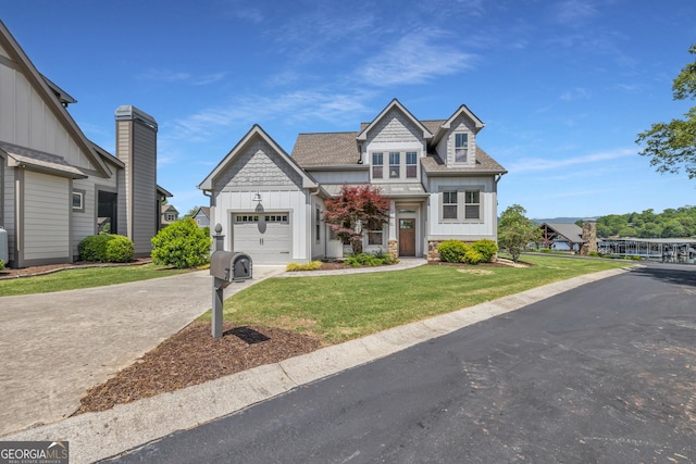craftsman house with board and batten siding, concrete driveway, an attached garage, a front yard, and a shingled roof
