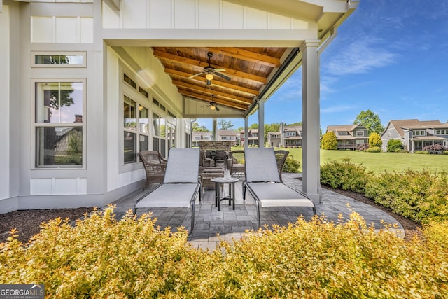 view of patio / terrace with a ceiling fan and a residential view