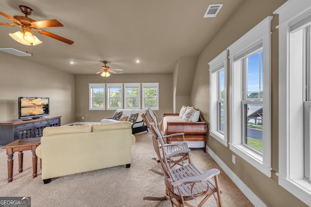 living area with light colored carpet, recessed lighting, ceiling fan, and baseboards