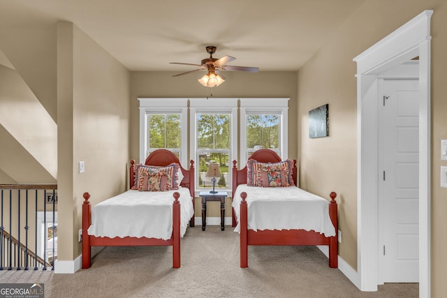 bedroom featuring carpet floors, baseboards, and a ceiling fan