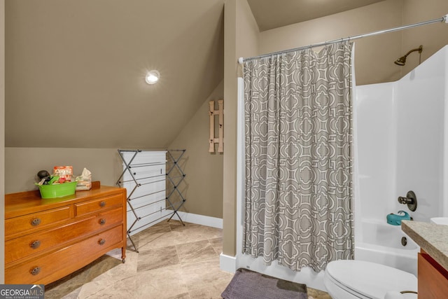full bath featuring shower / bath combo with shower curtain, vanity, toilet, vaulted ceiling, and baseboards
