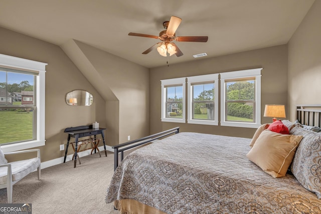 carpeted bedroom with baseboards and a ceiling fan