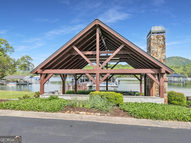 view of community featuring a water view and a gazebo