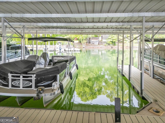 dock with boat lift and a water view