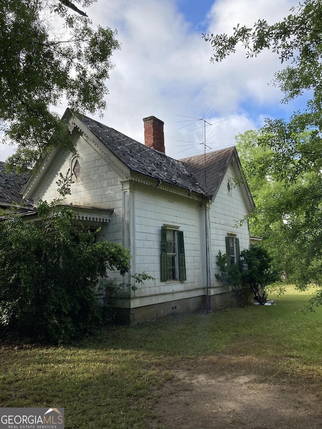 12196 Linton Rd S, Sparta, GA 31087 - view of side of property with a chimney, a lawn, and crawl space