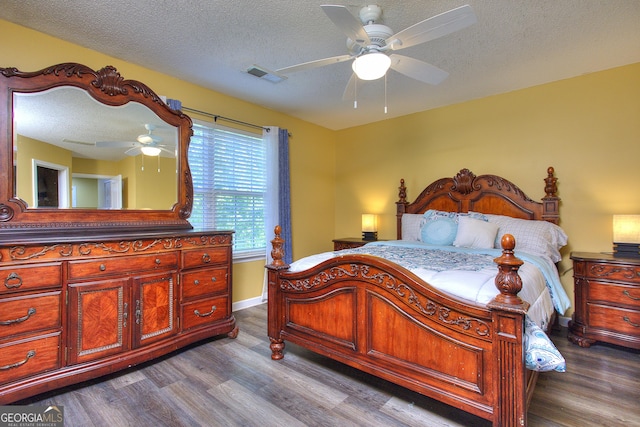 2326 Nicole Dr, Hampton, GA 30228 - bedroom with dark wood-style floors, baseboards, a textured ceiling, and ceiling fan