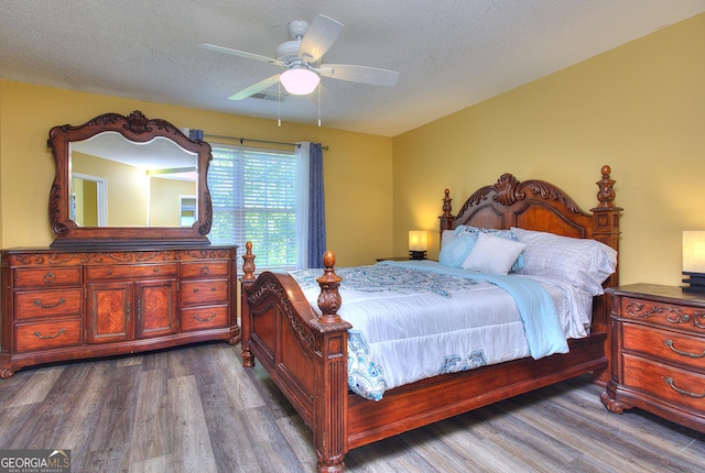 2326 Nicole Dr, Hampton, GA 30228 - bedroom featuring dark wood finished floors, a ceiling fan, and a textured ceiling