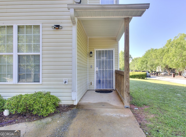 2326 Nicole Dr, Hampton, GA 30228 - view of exterior entry featuring a yard