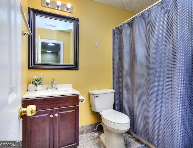 2326 Nicole Dr, Hampton, GA 30228 - bathroom featuring toilet, vanity, wood finished floors, and curtained shower