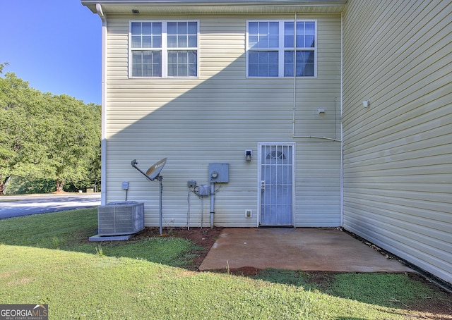 2326 Nicole Dr, Hampton, GA 30228 - rear view of property featuring a patio, a yard, and central AC unit