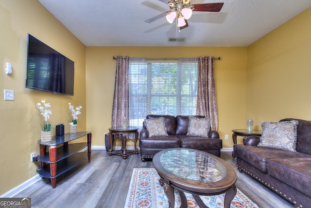 2326 Nicole Dr, Hampton, GA 30228 - living room with baseboards, wood finished floors, and a ceiling fan
