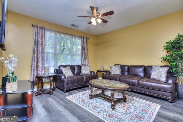2326 Nicole Dr, Hampton, GA 30228 - living area featuring a ceiling fan and wood finished floors