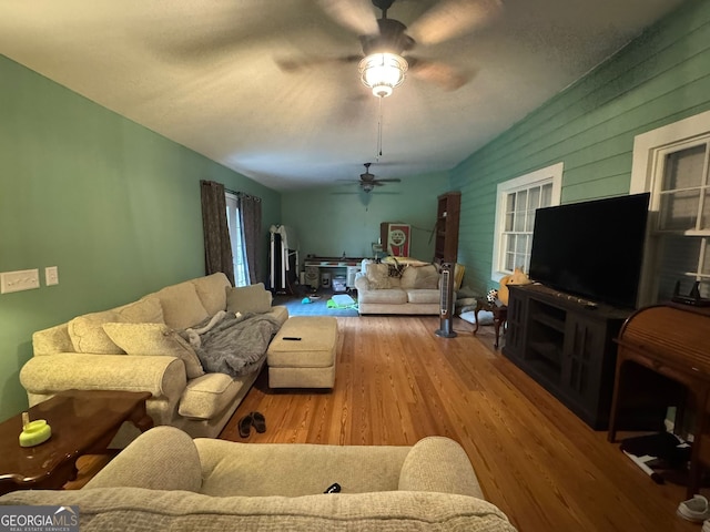 708 S Main St, Sylvania, GA 30467 - living room with ceiling fan, wood finished floors, and wooden walls