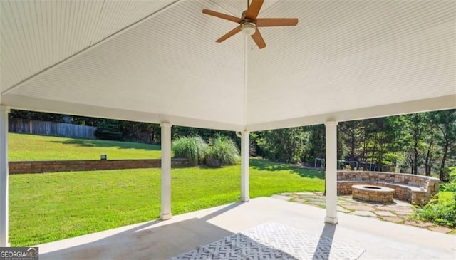 view of patio featuring an outdoor fire pit and ceiling fan