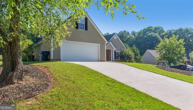 view of front of house with a garage, a front yard, and driveway