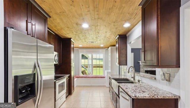 kitchen with appliances with stainless steel finishes, a sink, wood ceiling, light tile patterned flooring, and recessed lighting