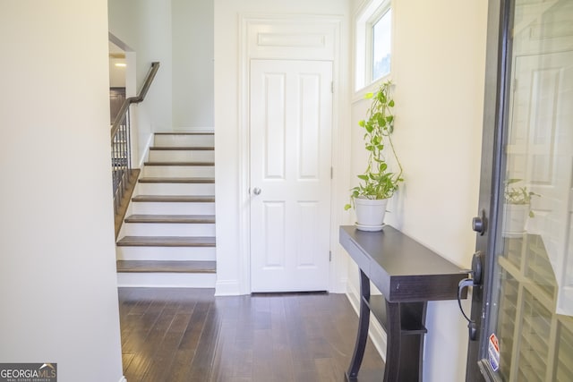 4448 Tacoma Trce, Suwanee, GA 30024 - entrance foyer with dark wood finished floors, stairway, and baseboards