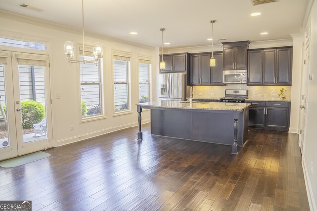 4448 Tacoma Trce, Suwanee, GA 30024 - kitchen featuring stainless steel appliances, dark brown cabinets, a sink, backsplash, and crown molding