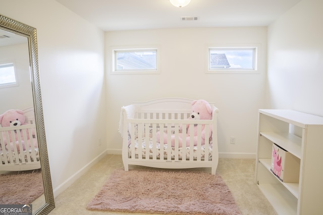 4448 Tacoma Trce, Suwanee, GA 30024 - bedroom with multiple windows, carpet floors, and a crib