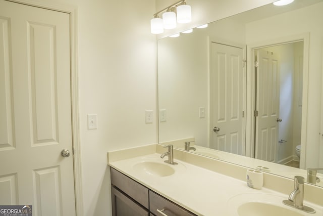 4448 Tacoma Trce, Suwanee, GA 30024 - bathroom featuring double vanity and toilet