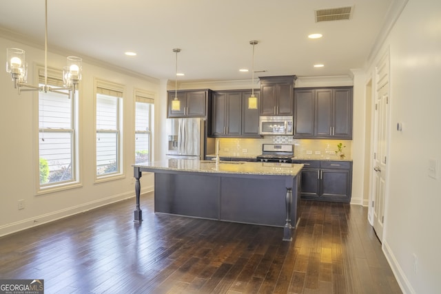4448 Tacoma Trce, Suwanee, GA 30024 - kitchen featuring appliances with stainless steel finishes, dark brown cabinets, backsplash, dark wood-style floors, and crown molding