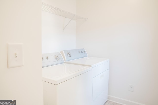 4448 Tacoma Trce, Suwanee, GA 30024 - laundry area with washing machine and clothes dryer and baseboards