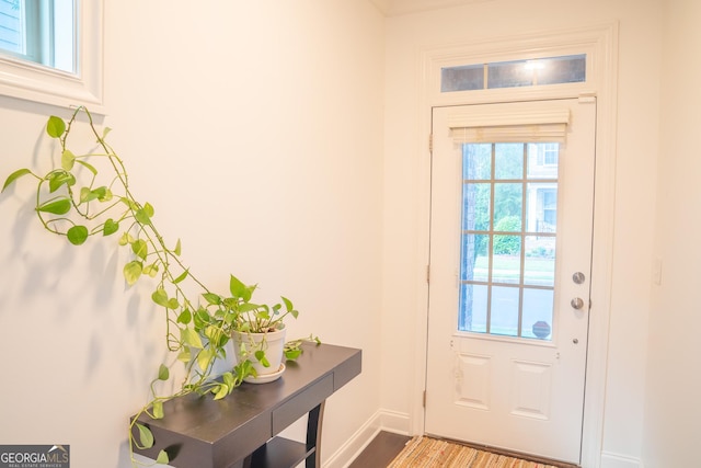 4448 Tacoma Trce, Suwanee, GA 30024 - doorway featuring baseboards and wood finished floors