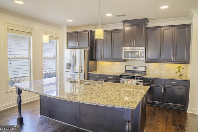 4448 Tacoma Trce, Suwanee, GA 30024 - kitchen with stainless steel appliances, a sink, baseboards, dark wood-style flooring, and crown molding