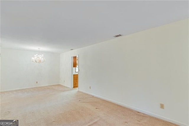 1471 Robinhood Trl, Gainesville, GA 30501 - empty room featuring a chandelier, light colored carpet, and baseboards