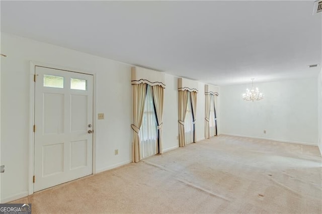 1471 Robinhood Trl, Gainesville, GA 30501 - entryway with a chandelier, light colored carpet, and baseboards