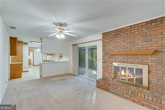 1471 Robinhood Trl, Gainesville, GA 30501 - unfurnished living room with a fireplace, light colored carpet, and ceiling fan