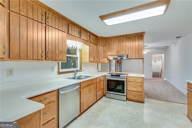 1471 Robinhood Trl, Gainesville, GA 30501 - kitchen with stainless steel appliances, under cabinet range hood, a sink, and light countertops