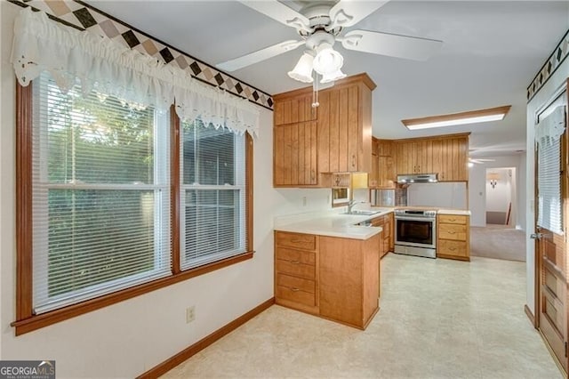1471 Robinhood Trl, Gainesville, GA 30501 - kitchen featuring stainless steel electric range oven, a ceiling fan, light countertops, under cabinet range hood, and a peninsula