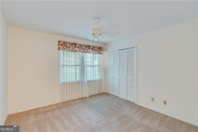 1471 Robinhood Trl, Gainesville, GA 30501 - unfurnished bedroom with carpet, a closet, and ceiling fan