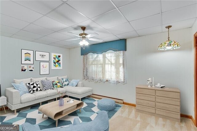1471 Robinhood Trl, Gainesville, GA 30501 - living area featuring baseboard heating, a drop ceiling, a ceiling fan, and baseboards
