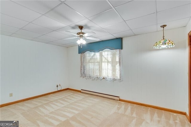 1471 Robinhood Trl, Gainesville, GA 30501 - carpeted spare room featuring a baseboard heating unit, a ceiling fan, baseboards, and a paneled ceiling