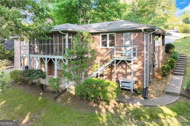 1471 Robinhood Trl, Gainesville, GA 30501 - rear view of property with stairs, brick siding, a sunroom, and a patio