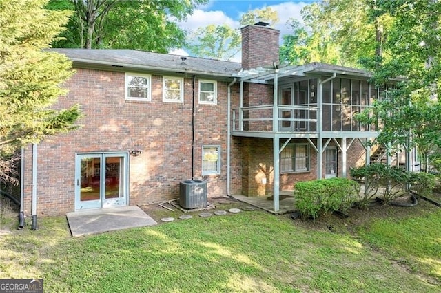1471 Robinhood Trl, Gainesville, GA 30501 - back of property featuring central AC, a chimney, a yard, and a sunroom