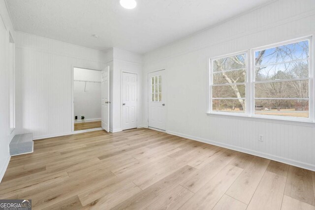 77 Frances St, Summerville, GA 30747 - unfurnished bedroom featuring light wood-style floors, multiple closets, and baseboards