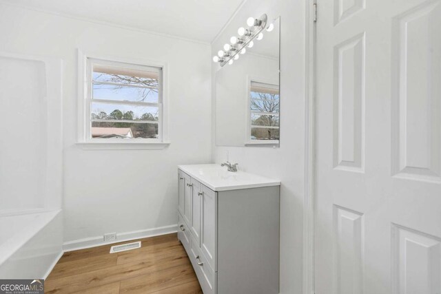 77 Frances St, Summerville, GA 30747 - bathroom with wood finished floors, vanity, baseboards, and crown molding