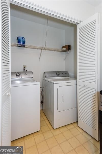 clothes washing area with independent washer and dryer